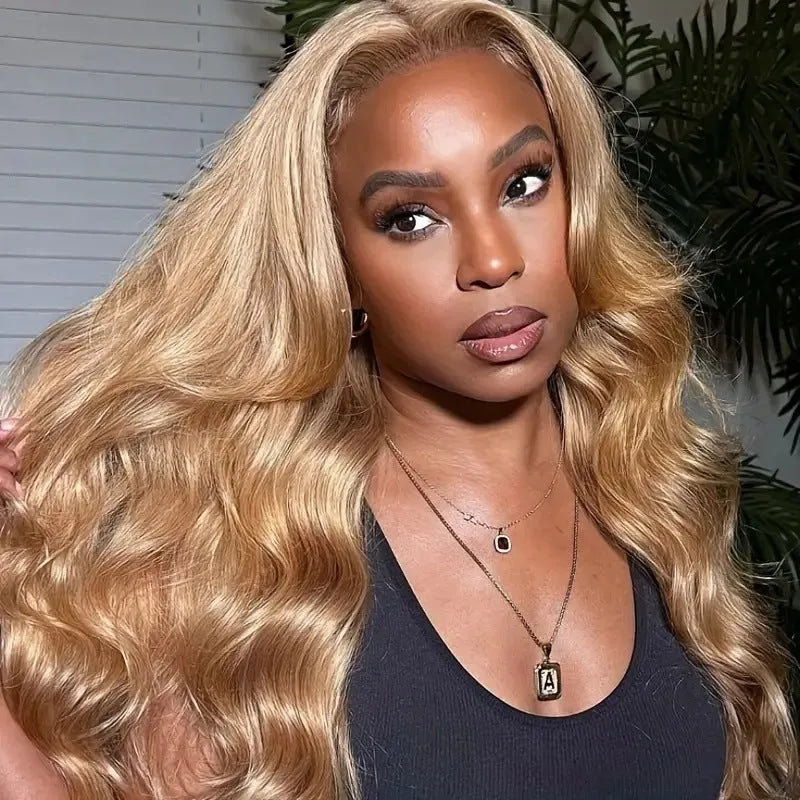 Light brown synthetic wig with long golden big waves, side bangs, and heat-friendly high temperature fibre.