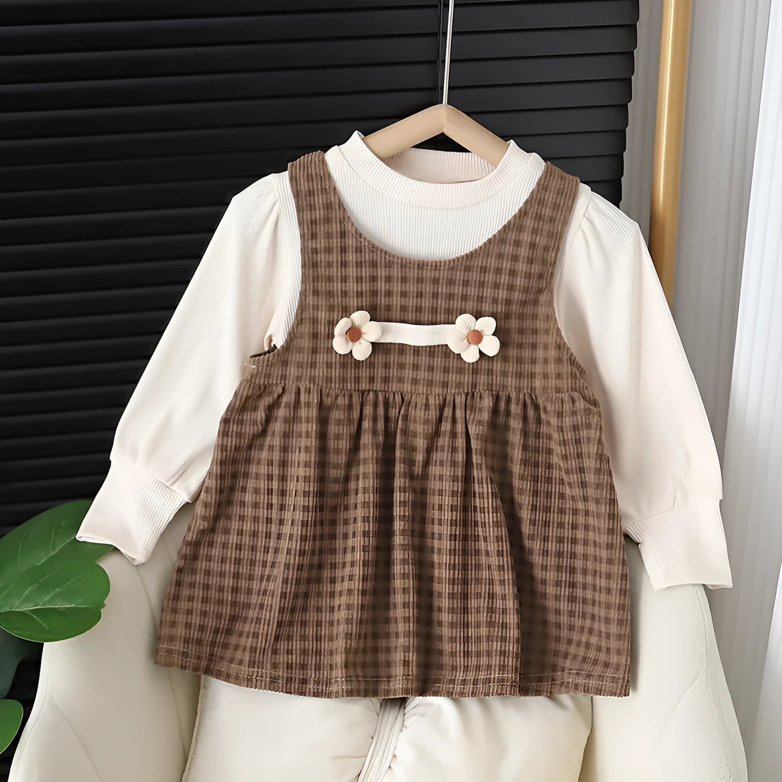 Baby girl wearing a dark coffee plaid long-sleeved dress and matching shirt, Korean style two-piece set.