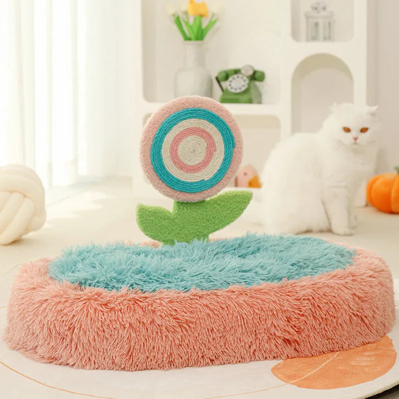 Pink plush elliptical cat bed with integrated lollipop-shaped bolster and removable cover