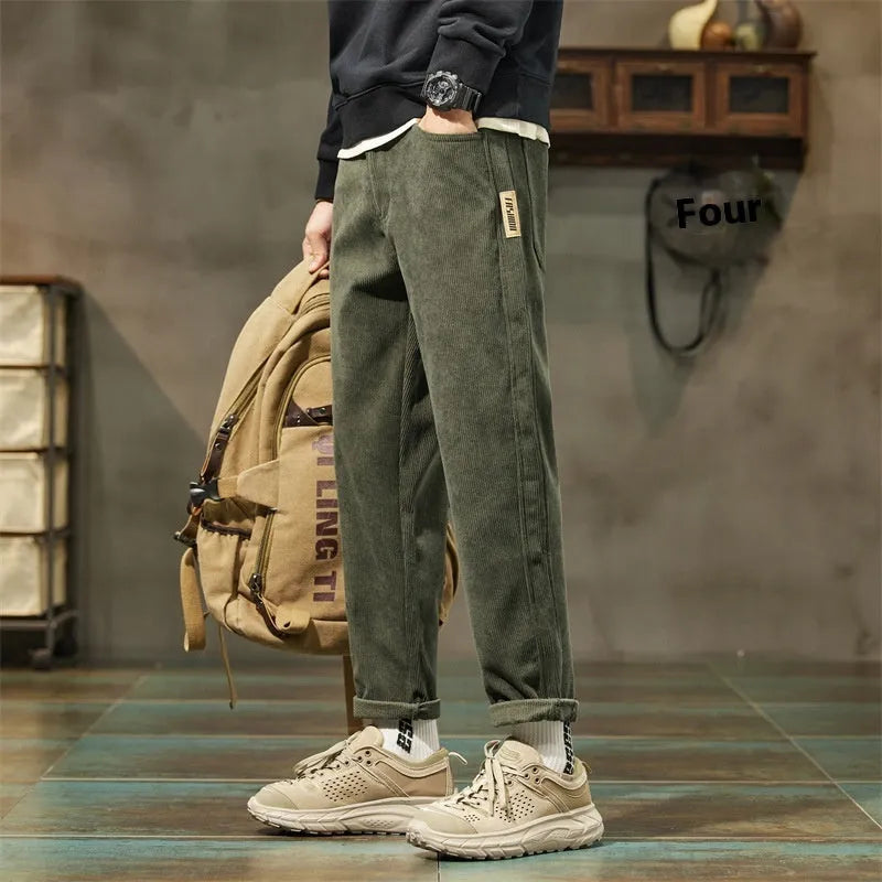 Men's corduroy casual trousers in tapered straight-leg style with mid waist and zipper fly closure