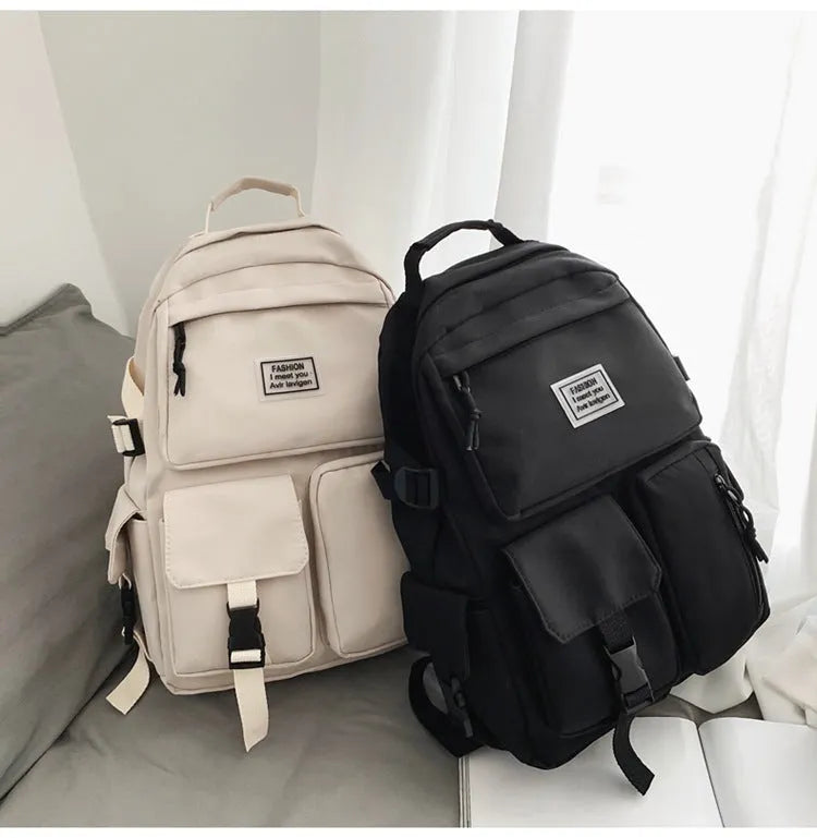 Black and white soft nylon student backpack with laptop compartment and three-dimensional pockets