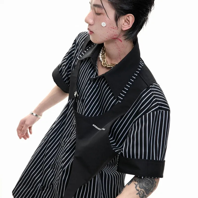 Man wearing a black and white striped short sleeve shirt with a distinctive double lapel collar design.