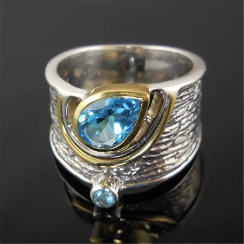 Women's blue zircon inlay ring in creative Chinese style drop shape design on alloy band