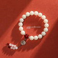 White jade Bodhi couple bracelet with 10mm round seeds in obsidian, red stone, and red code brain colours
