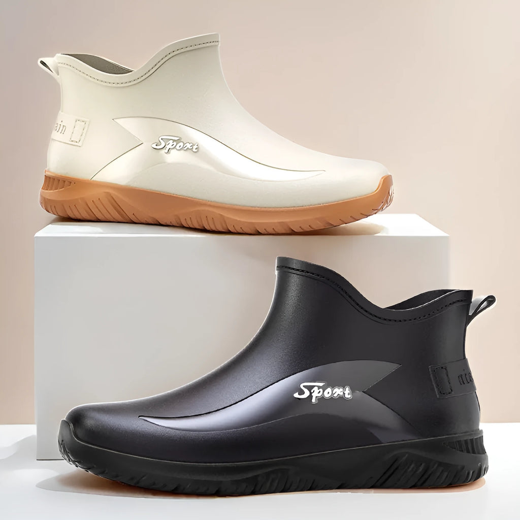 Men's short PVC wellington boots in beige and black colours with a flat non-slip sole.