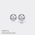Simple stainless steel stud earrings with geometric sphere design in gold colour on white background