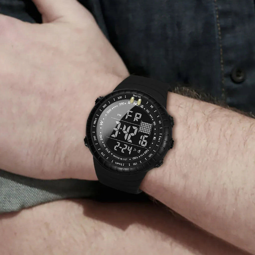 Black digital waterproof watch with large 54.74mm dial and textured PU strap on a wrist