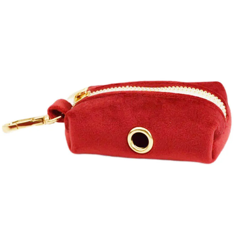 Cloth dog collar and leash set with red bow, matching vest, and flower accessory on a small dog.