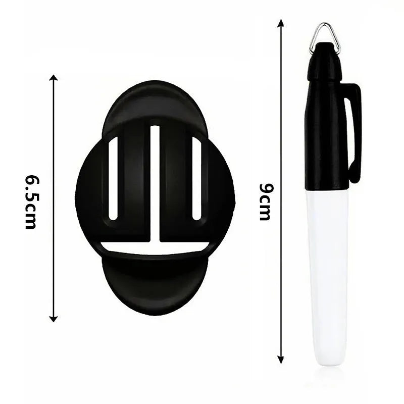 Plastic golf ball alignment scriber tool with drawing pens on a green.