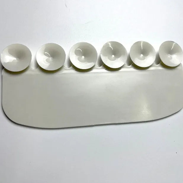 White PVC toilet urine blocking board for children's training placed on toilet rim