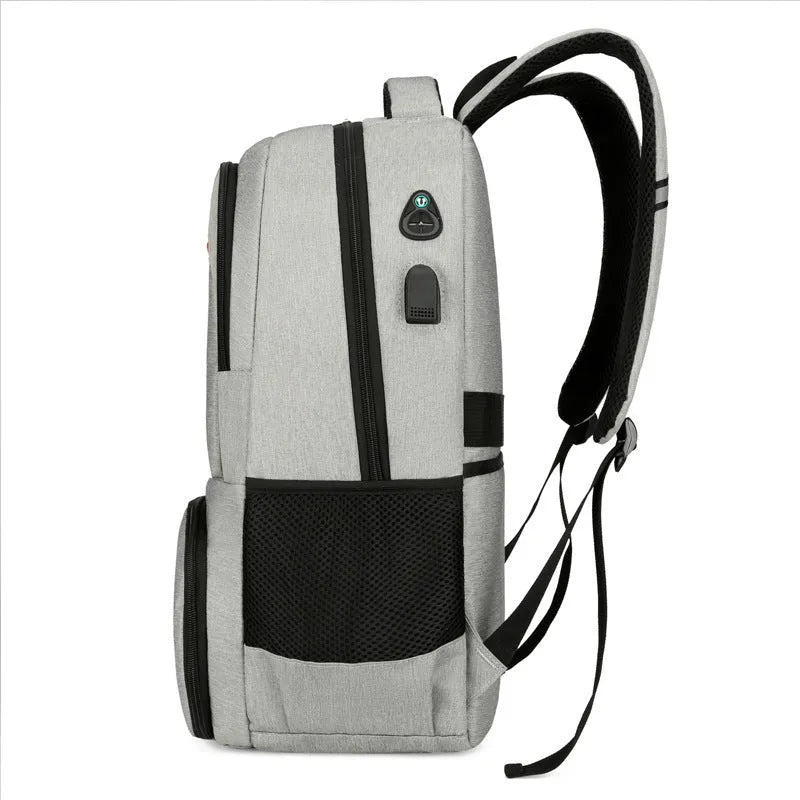 Light grey insulated Oxford cloth backpack with curved shoulder straps and wet-dry separation compartments.