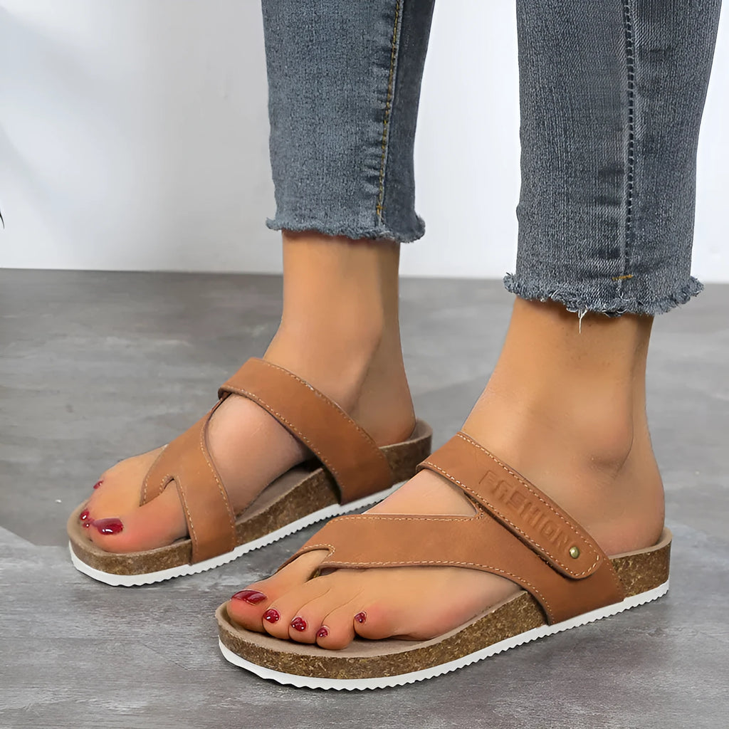 Flat toe ring thick-soled flip-flops in blue, showing artificial PU upper and foam sole.