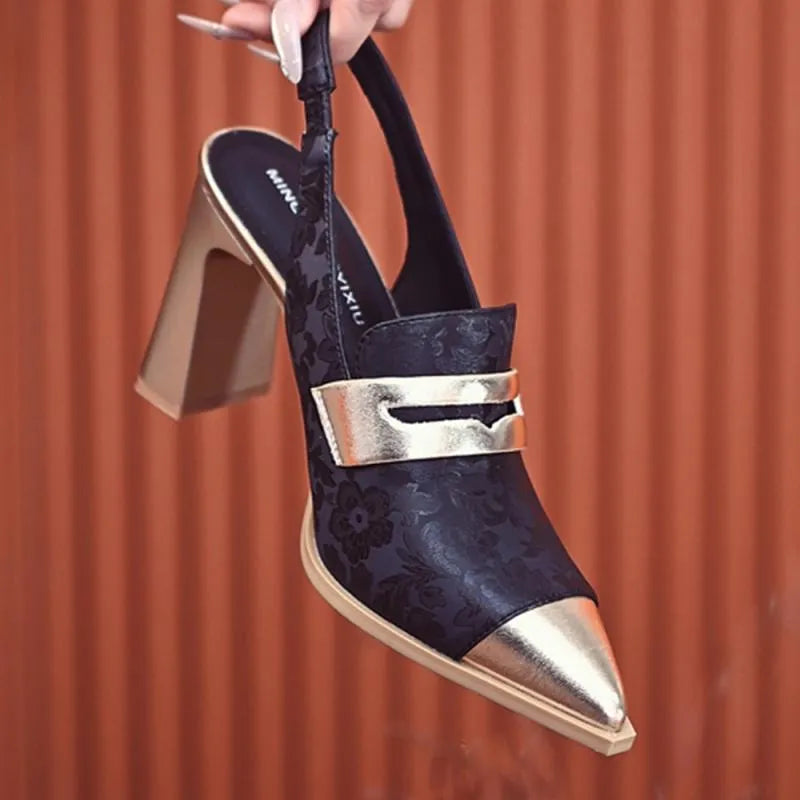 Women's black high heel sandals with chunky heel, pointed toe, and an elastic ankle strap.