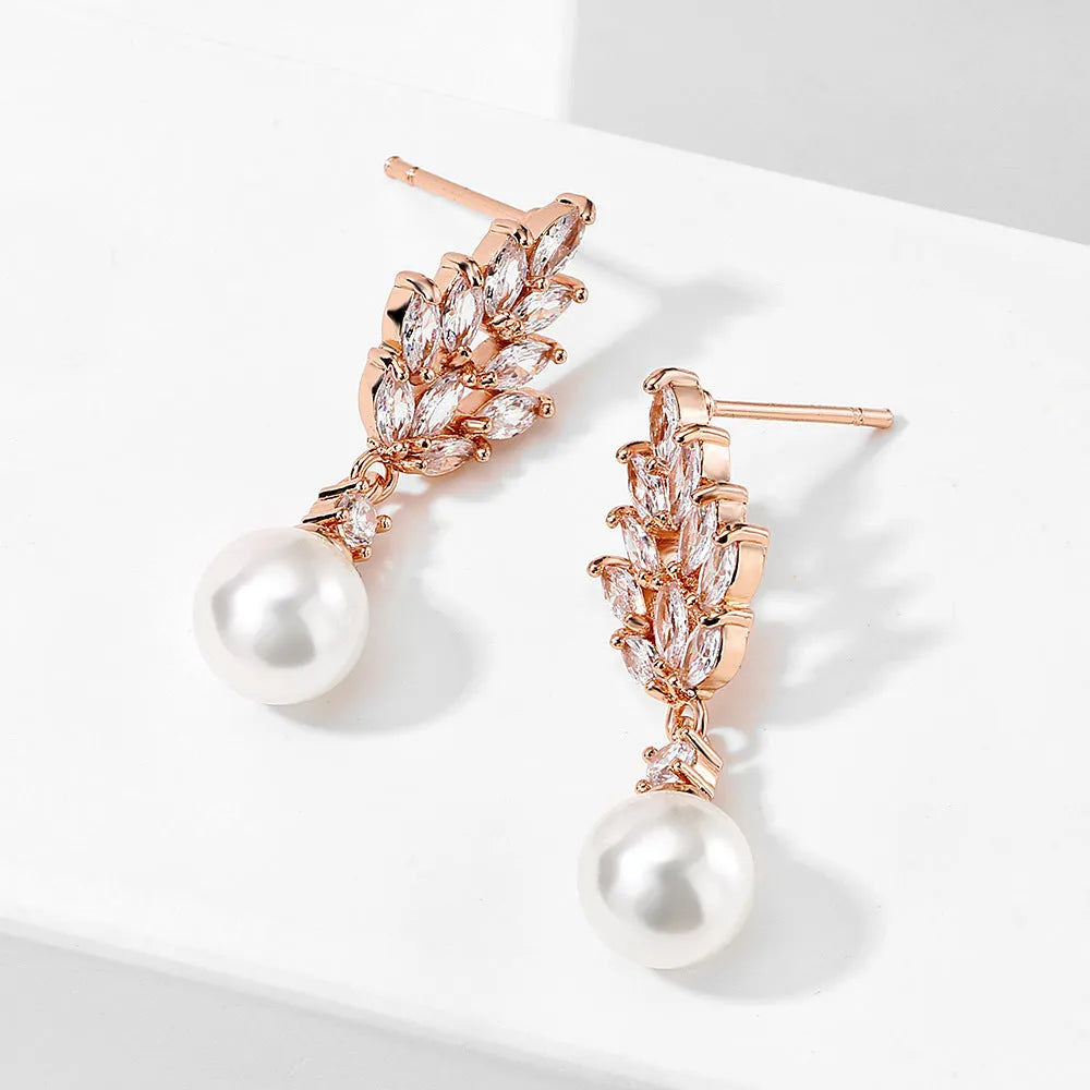 Geometric flower design earrings with micro inlaid zircon and pearl accents in gold, platinum, and rose gold plating.