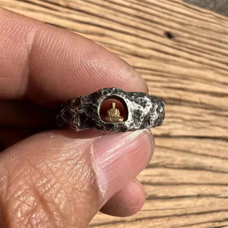 Hand-forged copper Grotto Buddha ring with a rock texture band.