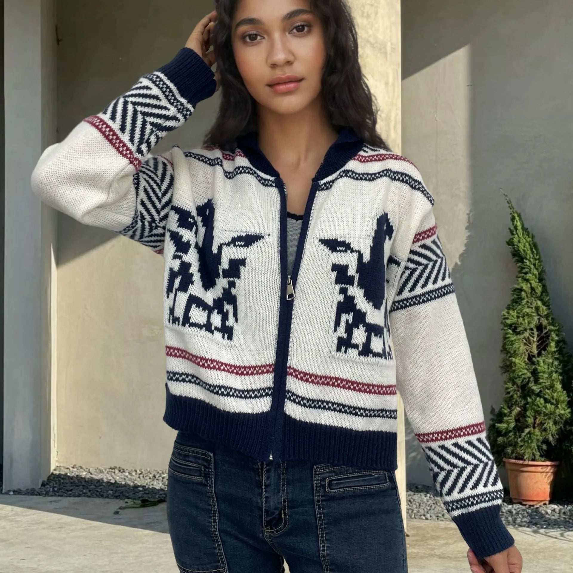 White women's cardigan with front zipper, lapel collar, and jacquard weave pattern