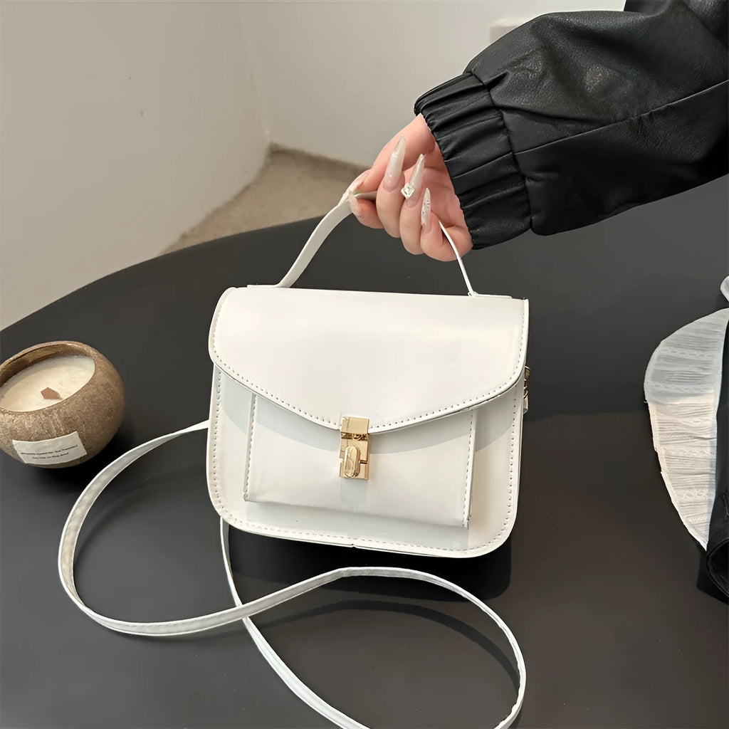 Retro shoulder messenger bag in horizontal square design with crossbody strap and sandwich pocket