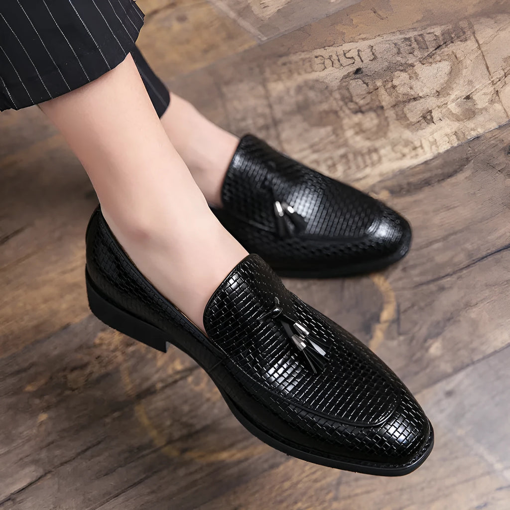 Men's black pointed toe slip-on shoes with tassel detail for business wear