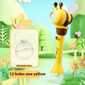 Yellow electric bee bubble machine toy with automatic lights on a flat surface