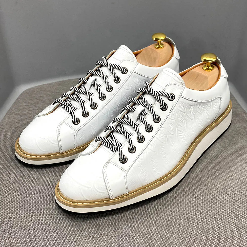 Men's low tube casual shoes with an embossed pattern on the upper and front tie laces.