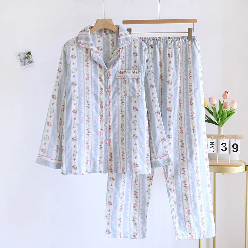 Women's red fruit print cotton gauze long-sleeved top and trousers two-piece loungewear set laid flat.
