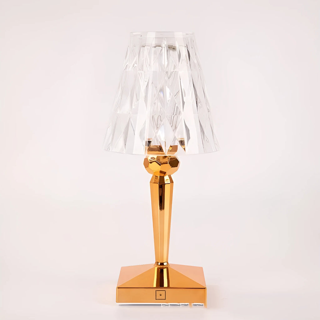 Rose gold portable touch projection night light with dimming controls on acrylic base.