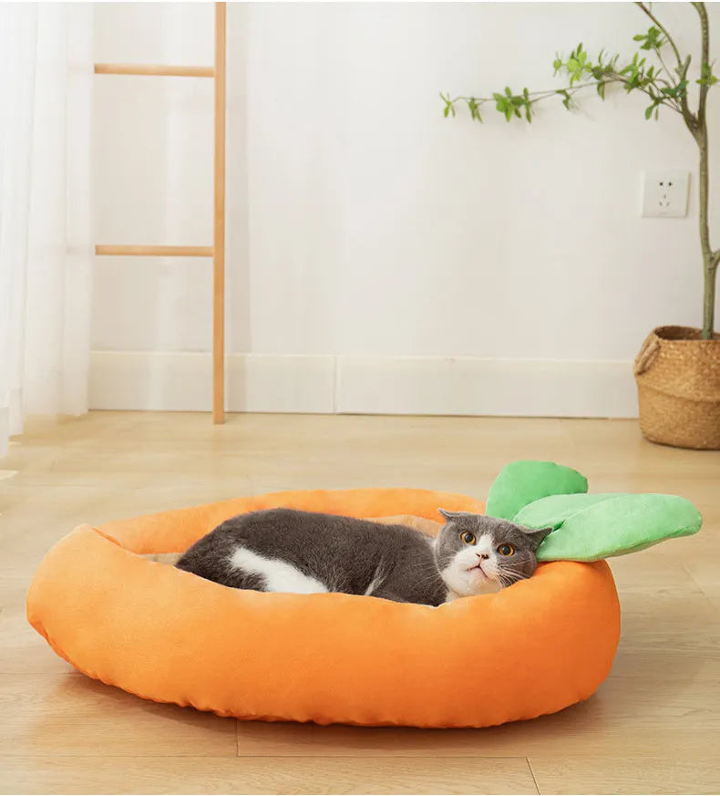 Carrot-shaped nesting dog bed with a soft blanket for small to medium-sized dogs.