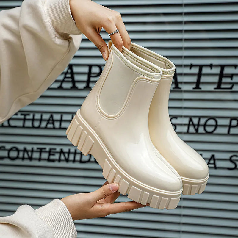 Low tube PVC rain boots in apricot colour with a non-slip sole and flat heel.