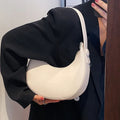 Women's retro brown PU dumpling shape shoulder bag with a front pocket shown.