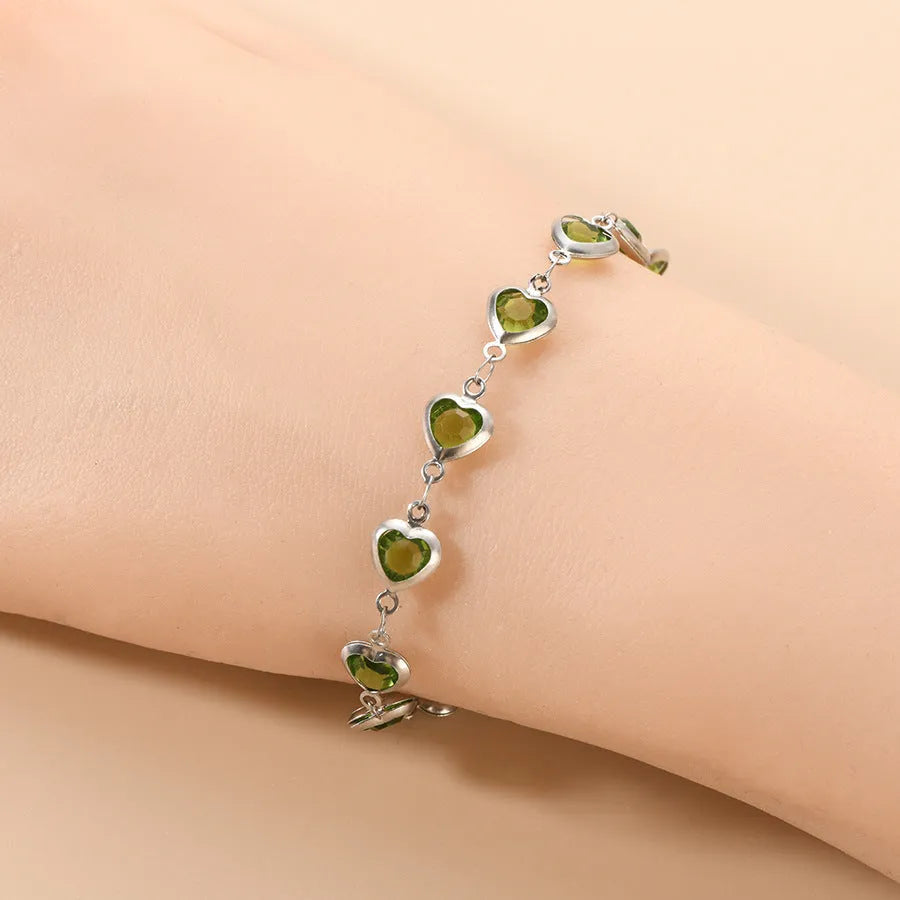 Geometric stainless steel heart bracelet showing six electroplated colour options on white background