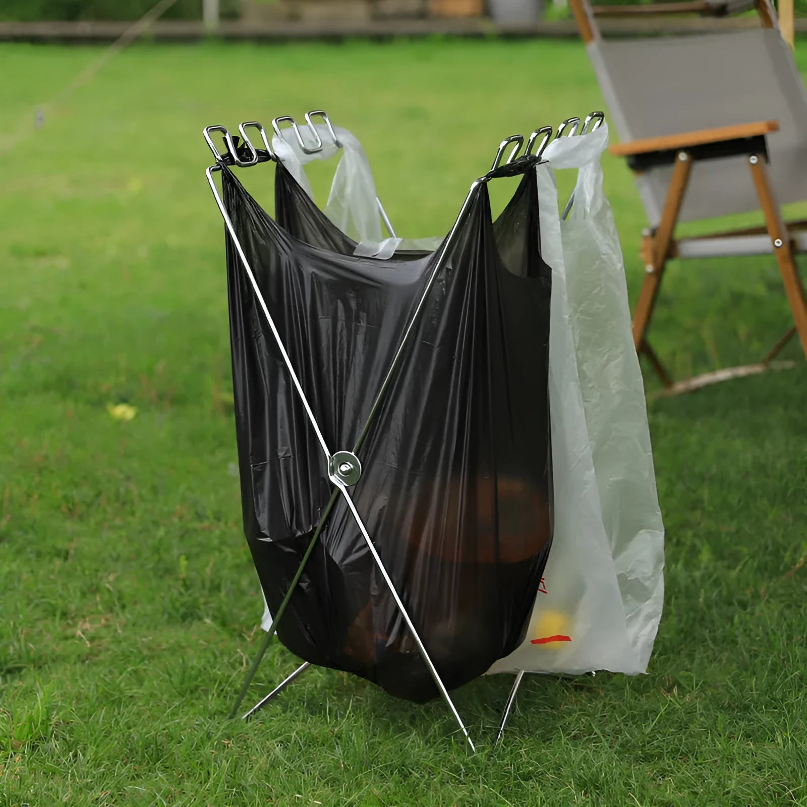 Silver folding garbage bag bracket made from stainless steel for camping and household waste management