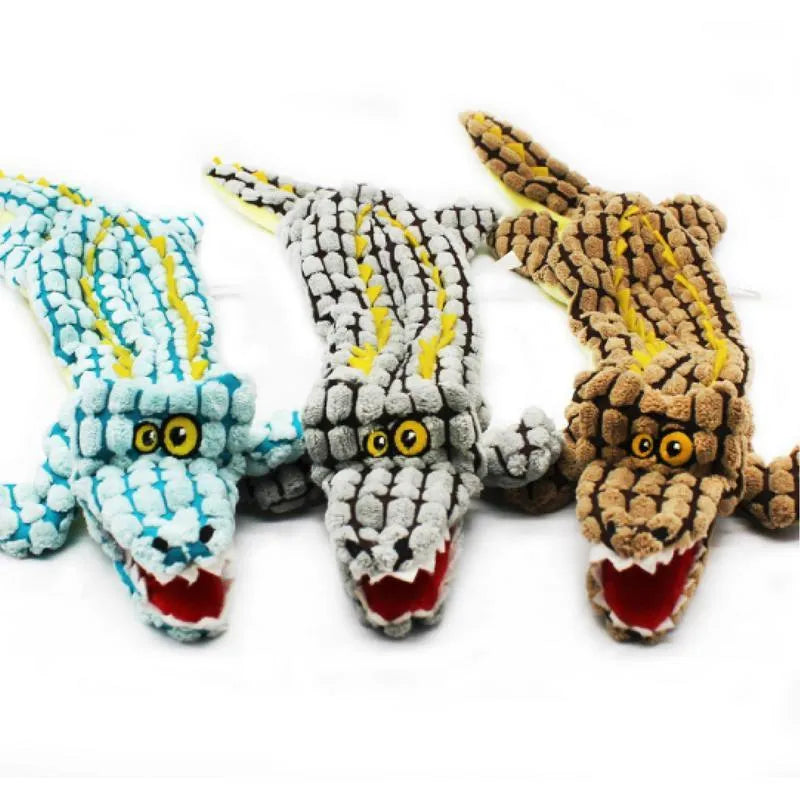 Blue crocodile-shaped plush squeaky dog toy shown beside coffee and grey colour options in small and large sizes