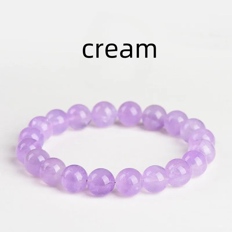 Lavender round amethyst bead bracelet with water ripple texture on a light background.