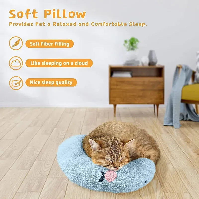 Small white half-donut U-shaped plush pillow for a cat or small dog on a carpet