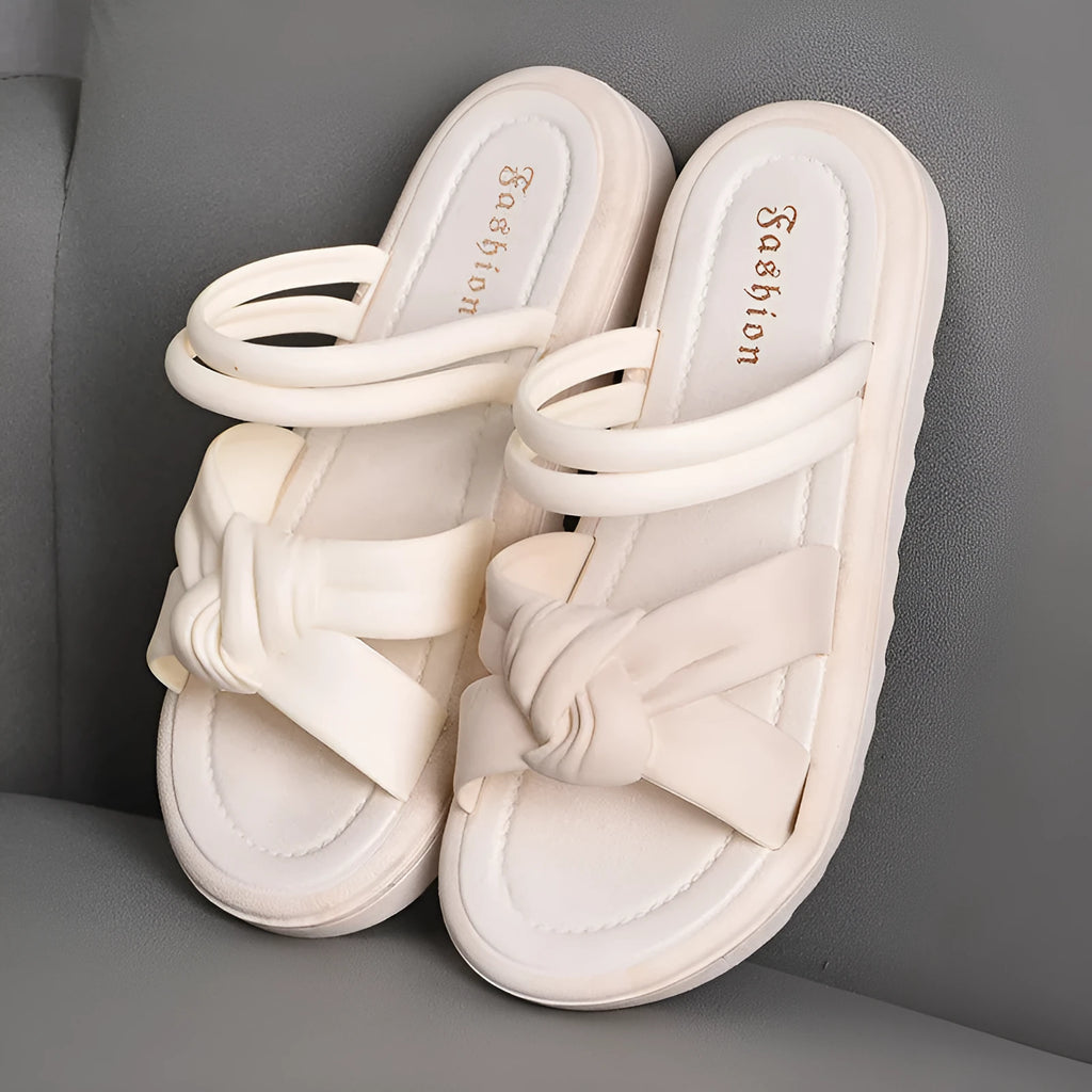 Women's black outdoor sandals with thick soft back and flower detailing on PVC upper