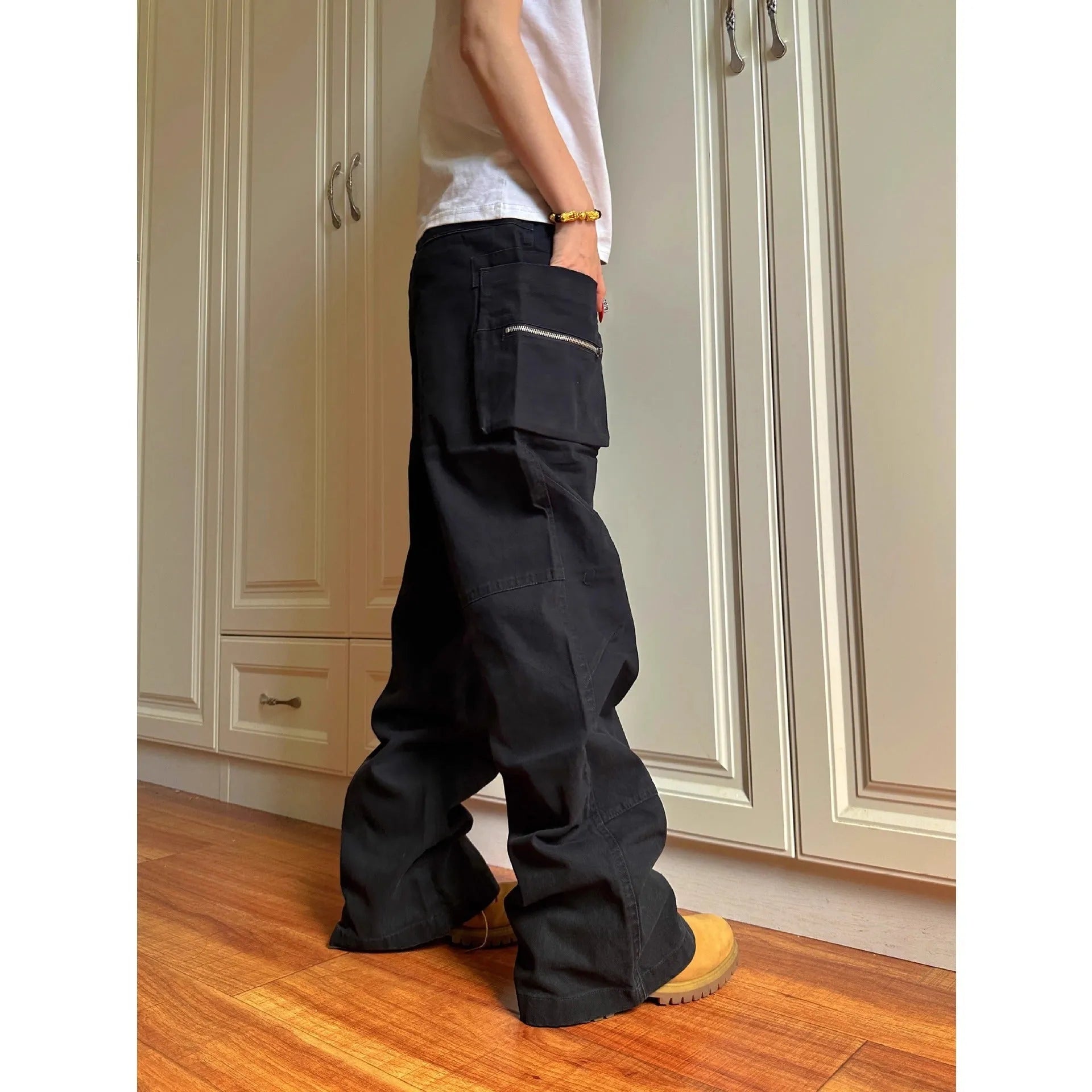 Green double zip cotton casual workwear trousers with a pocket, shown in a mid-waist fit.