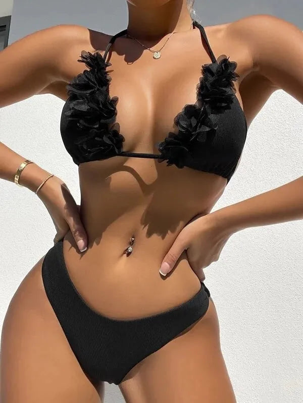 Black women's bikini set with gathered ruffle detail on top and matching shorts