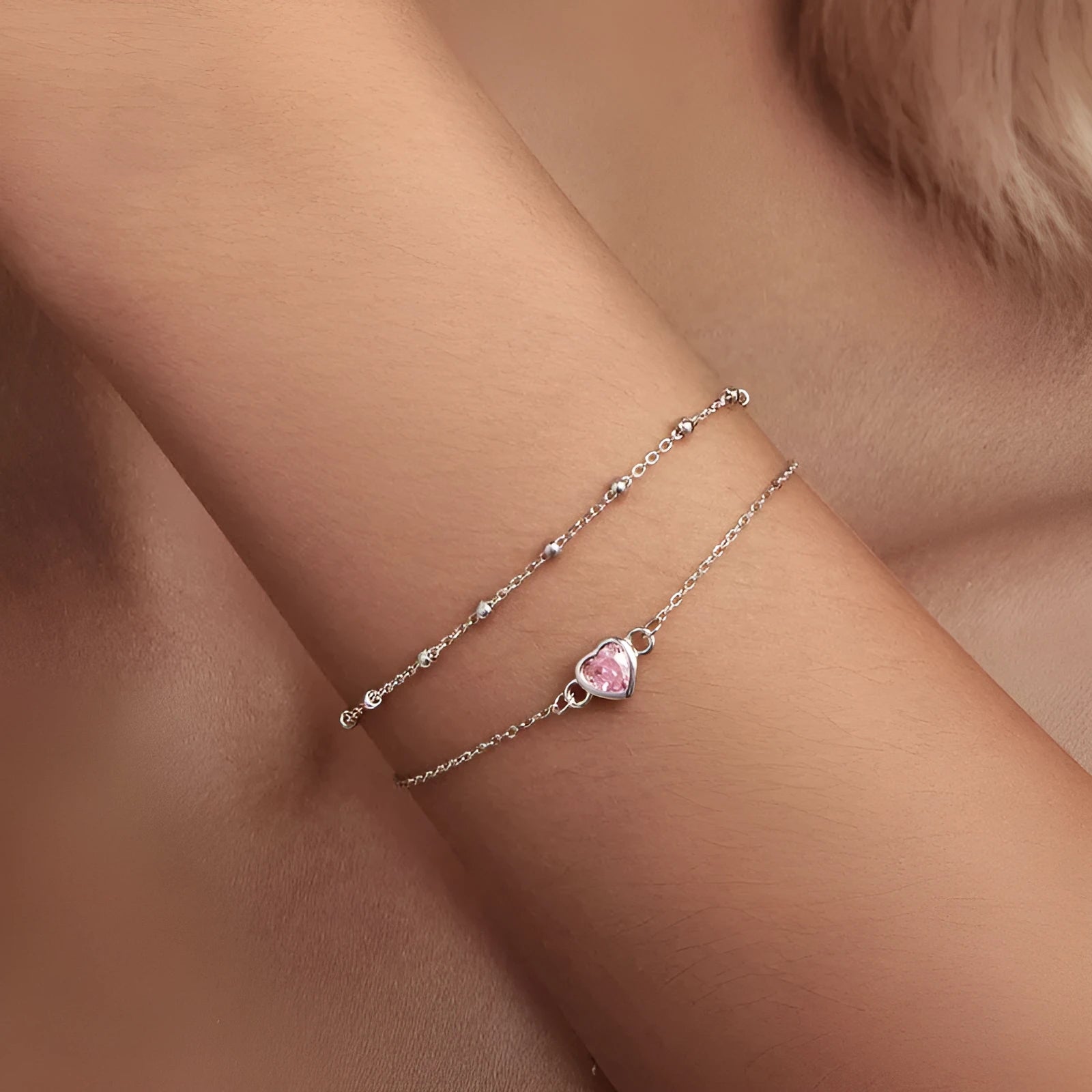 Sweet style sterling silver bracelet with small heart pendant on an adjustable chain.