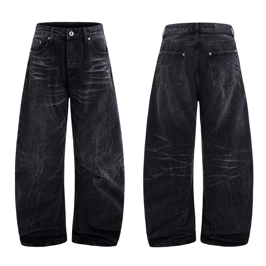 Black straight-leg men's jeans with a distressed lightning crack pattern on the legs.