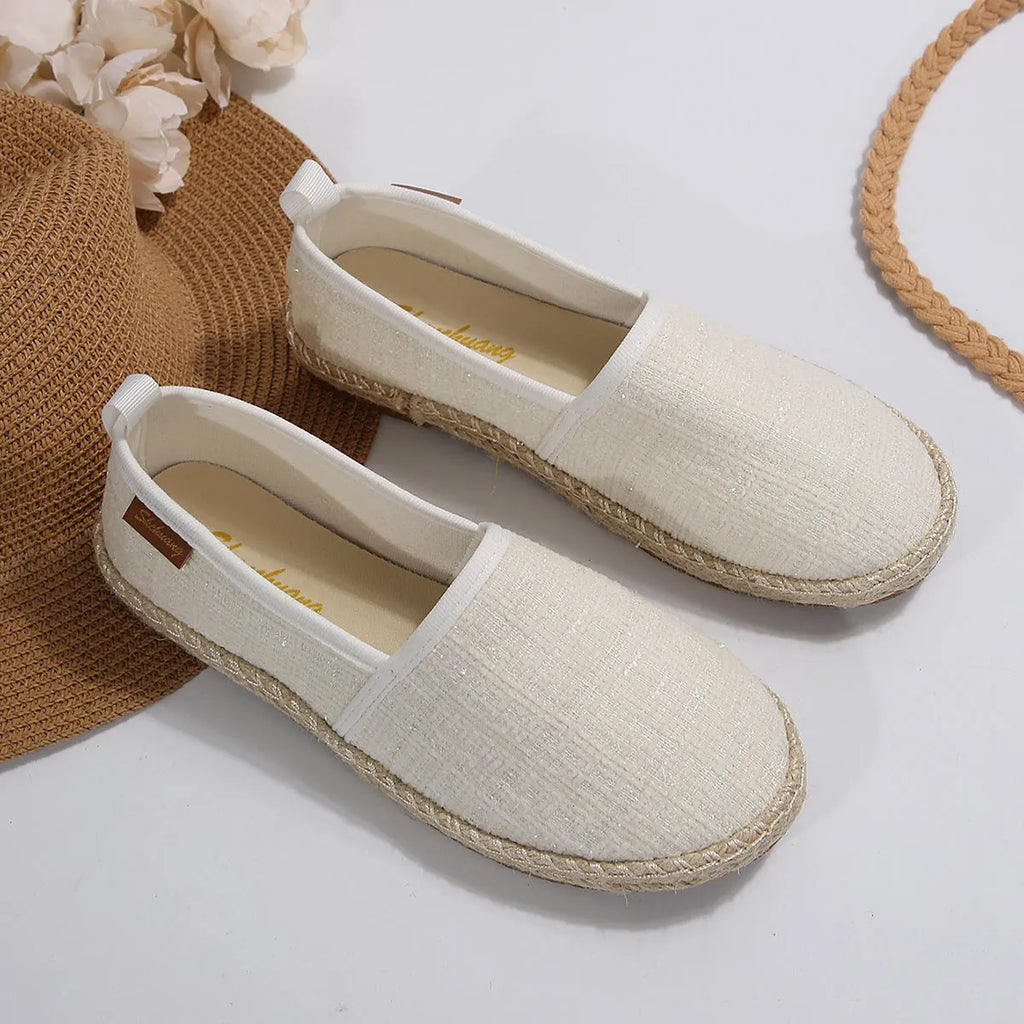 Casual fisherman shoes with canvas upper and rope sole bottoms in black, white and beige colours