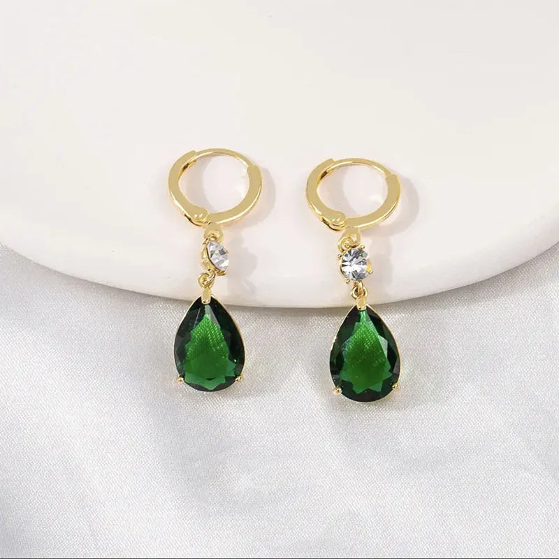 A pair of green geometric teardrop-shaped dangle earrings made from alloy.