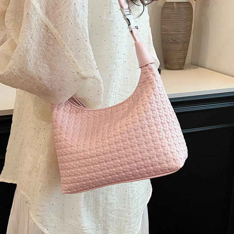 Soft PU leather bucket-style messenger bag in beige with a front sandwich pocket and shoulder strap.