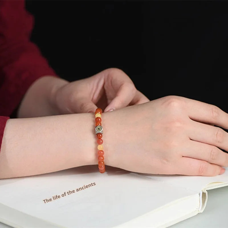 Natural Nanhong agate and beeswax bead zodiac constellation bracelet in 6mm and 8mm sizes.