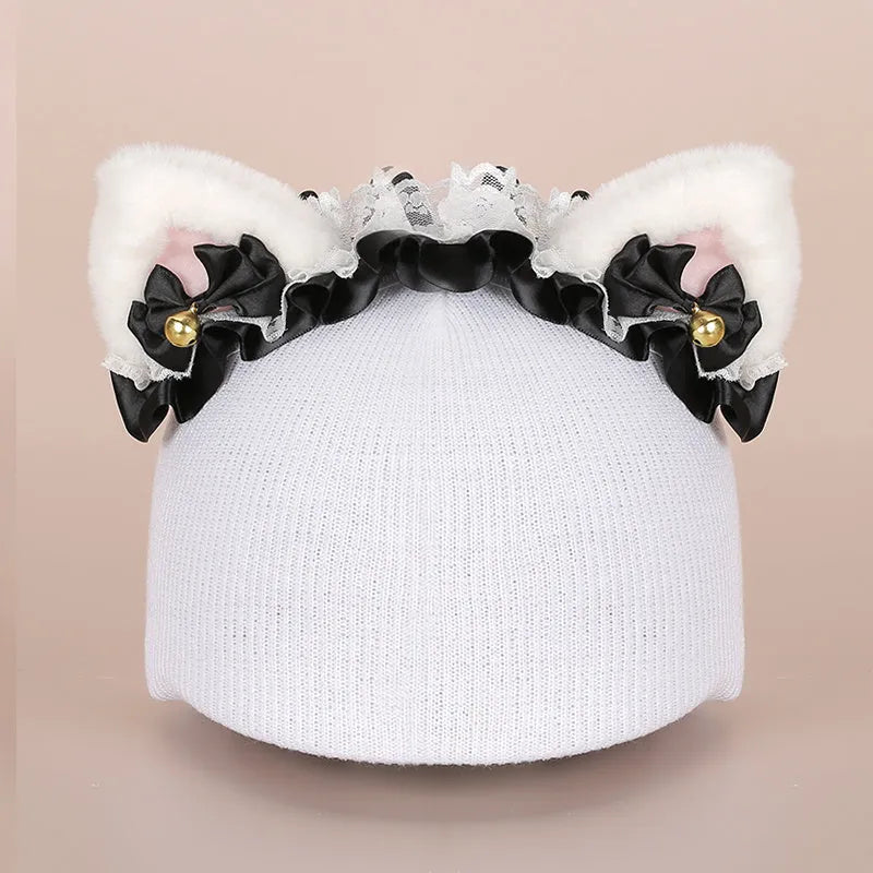 Plush fabric cartoon character decoration cover placed on a ski helmet.