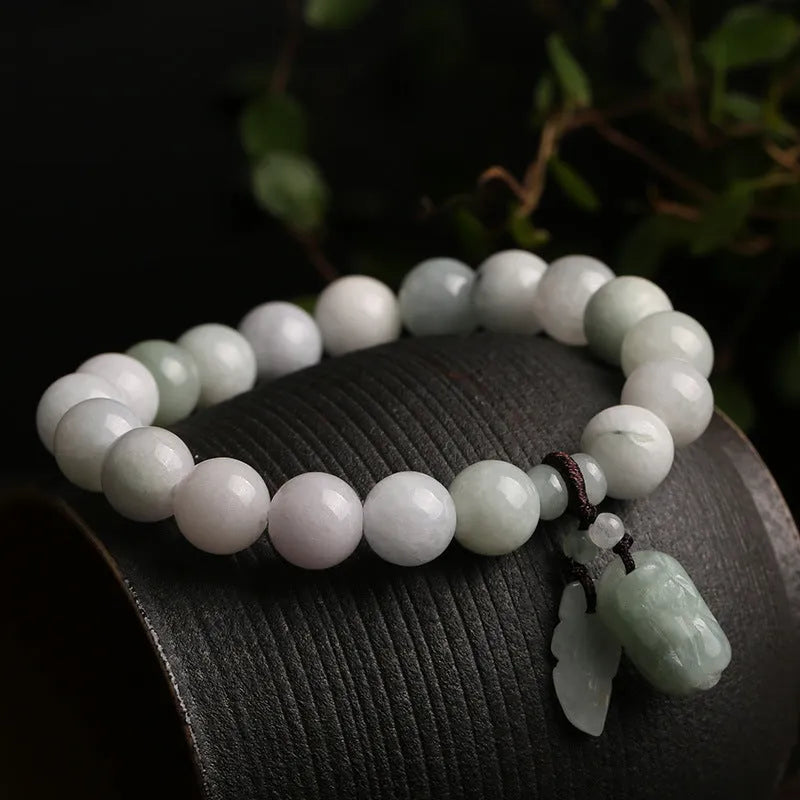 Natural jade bracelet with a choice of hanging charms: apple, double apple, money bag, gourd, or Maitreya Buddha.
