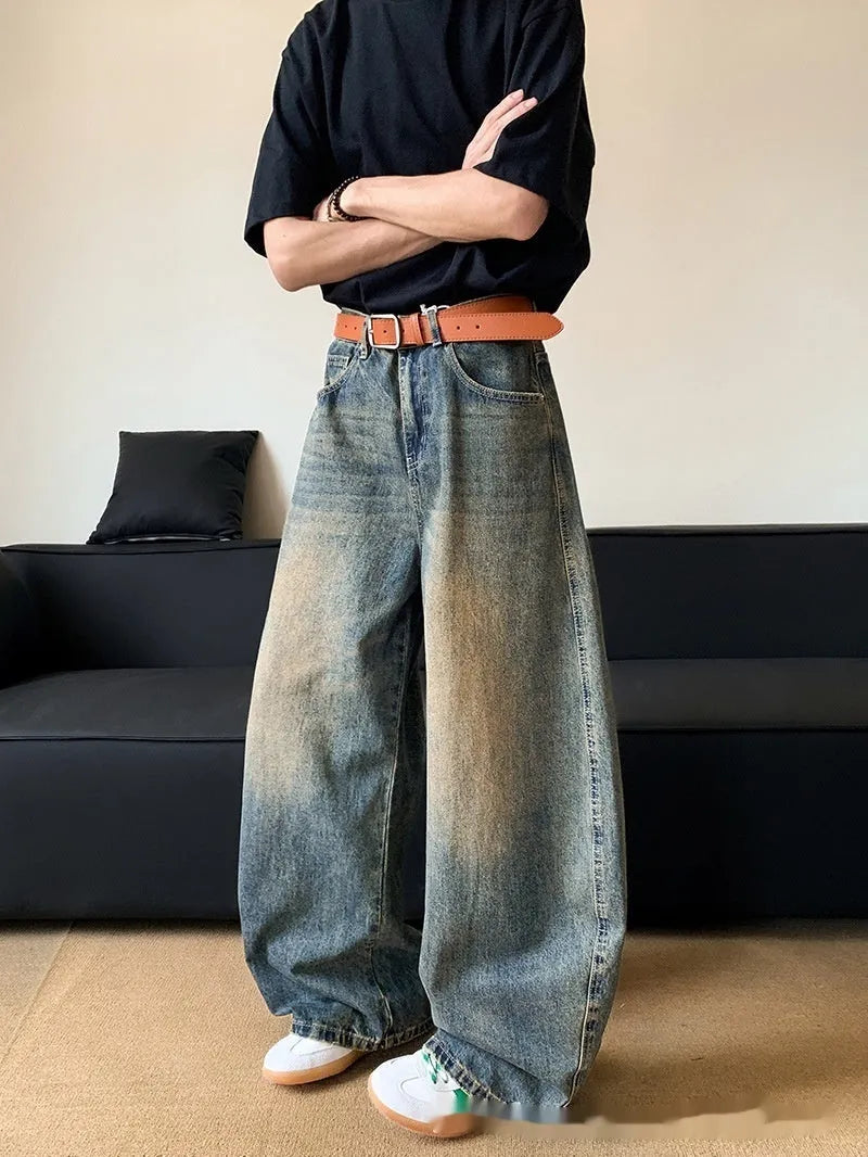 Retro blue distressed men's jeans with wide leg fit and micro elastic cotton blend fabric