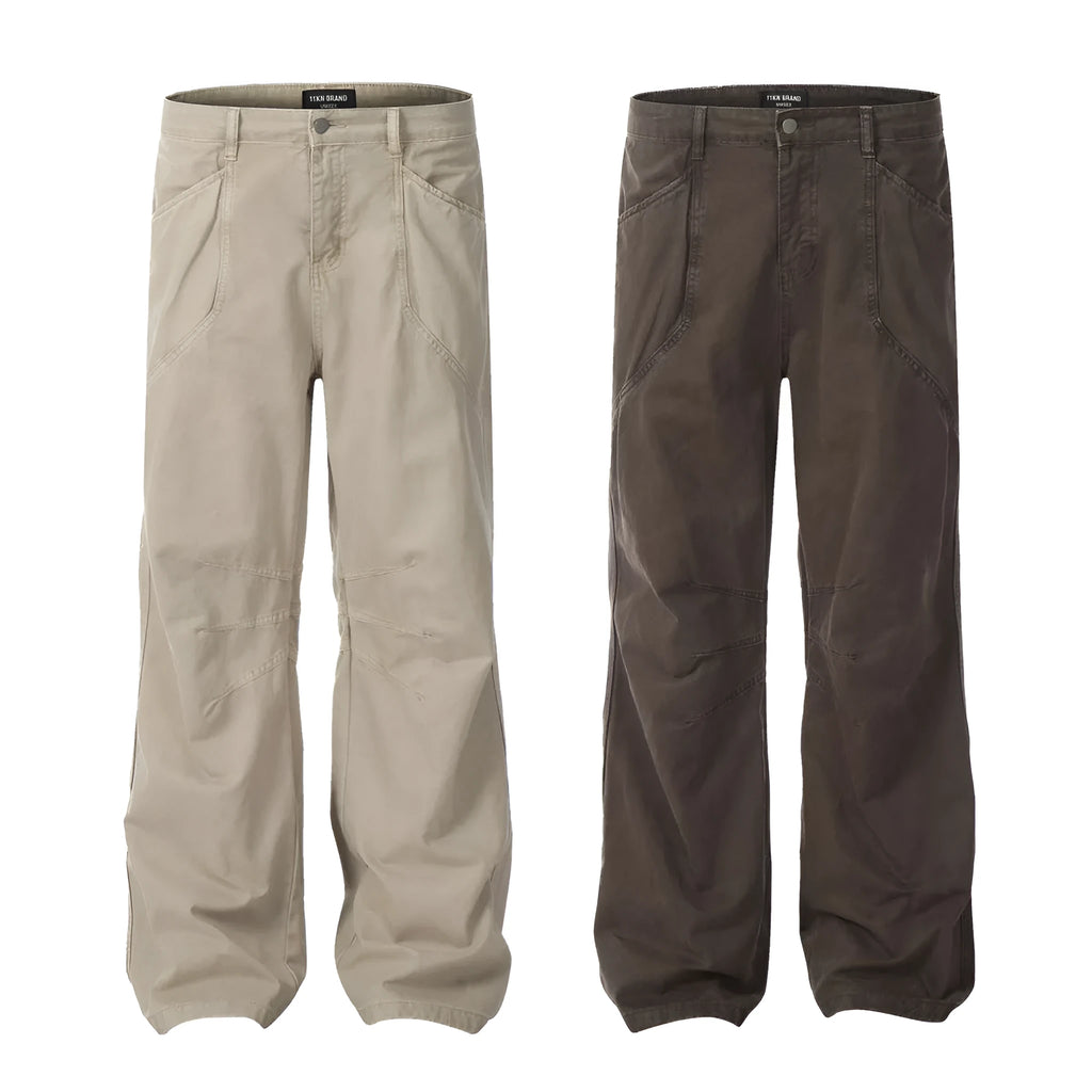 Men's brown loose straight leg jeans with high waist design and zip fly closure