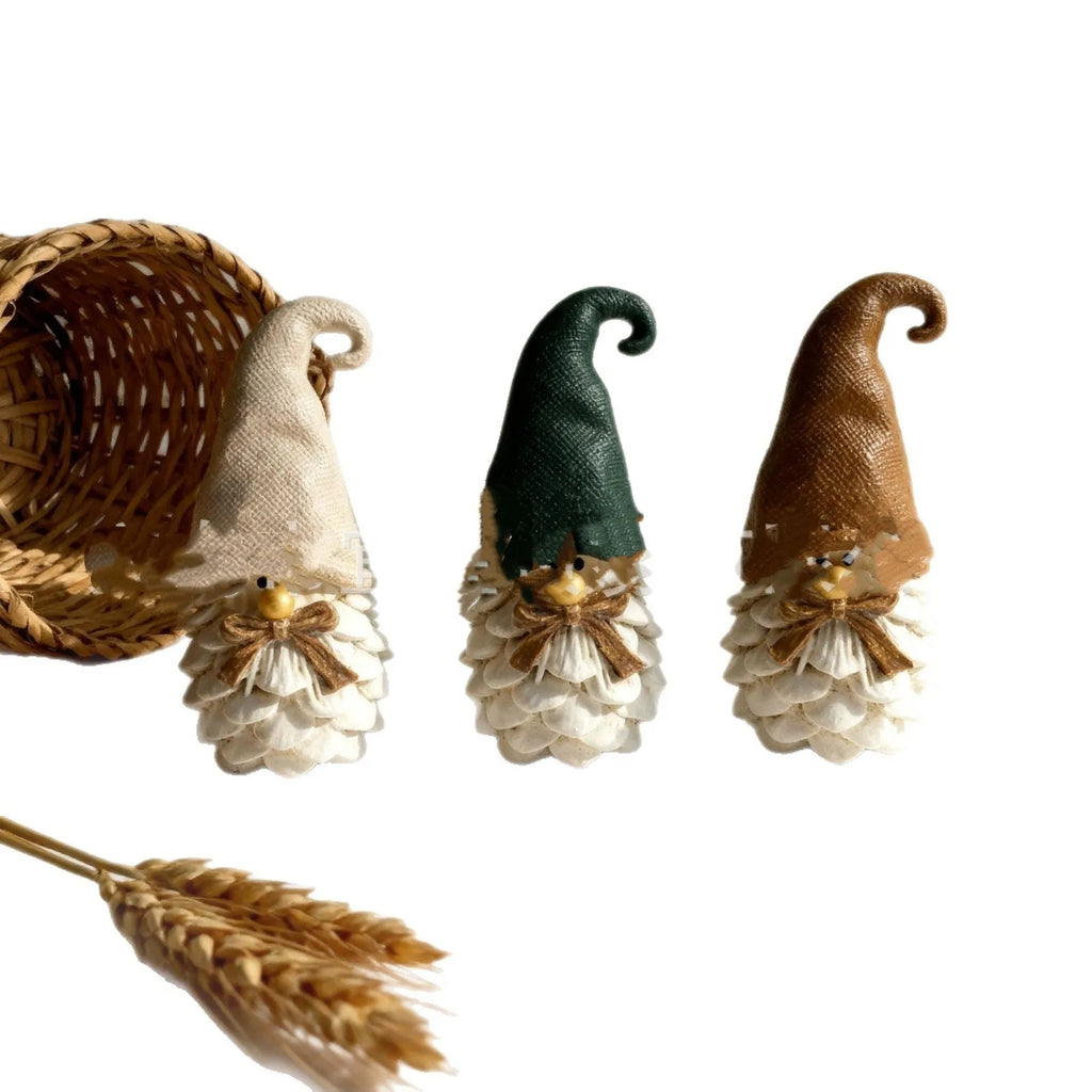 Set of three brown resin dwarf pine cone decorations on display