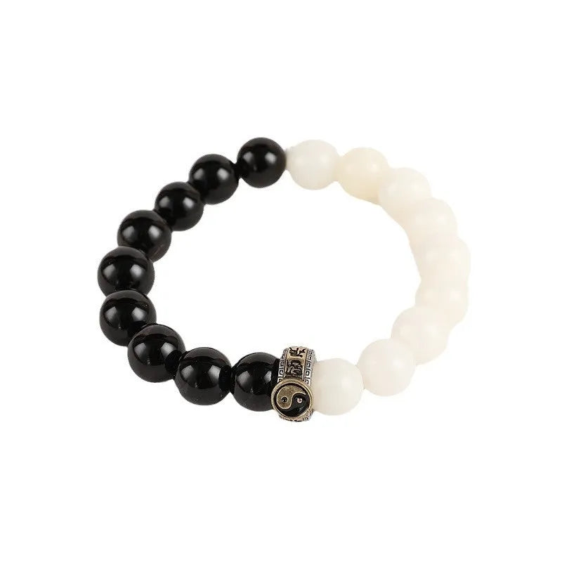 Black and white woven Taiji and Mantra bracelet on obsidian beads.