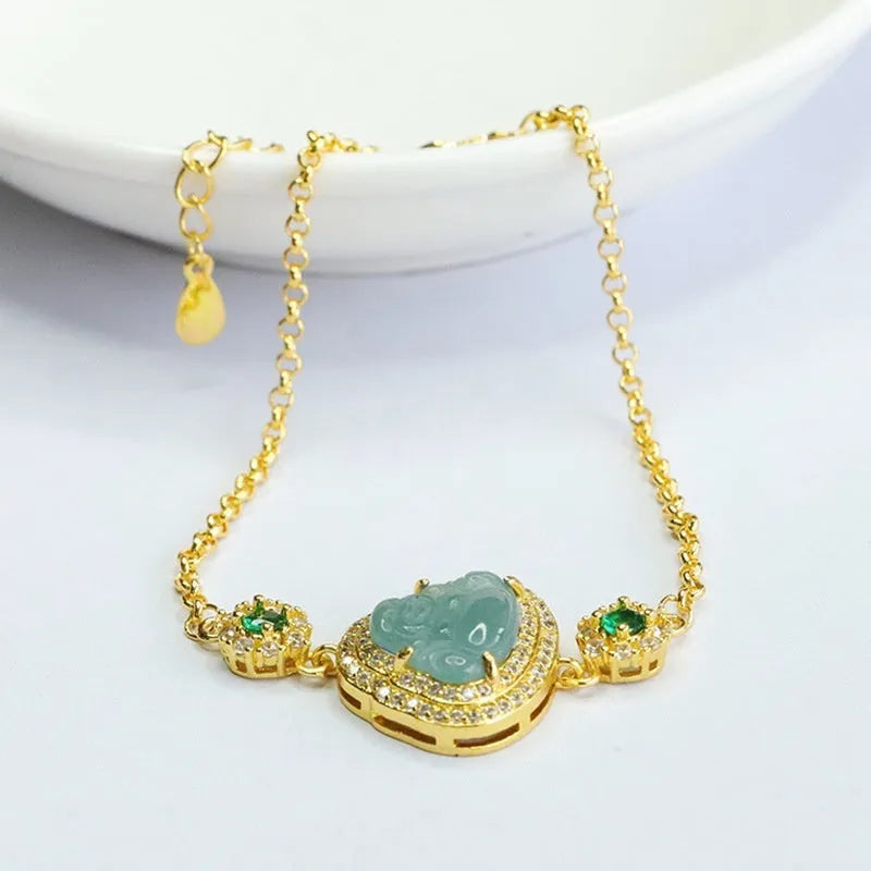 Emerald blue water jade bracelet with inlaid Maitreya Buddha carving, women's jewellery accessory.